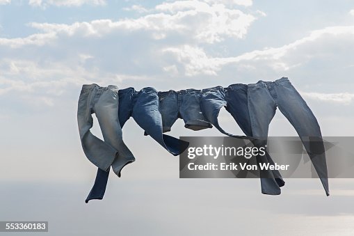 jeans hanging on a clothesline in the wind