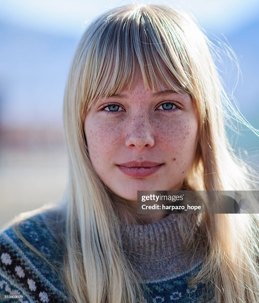 Young woman with freckles.