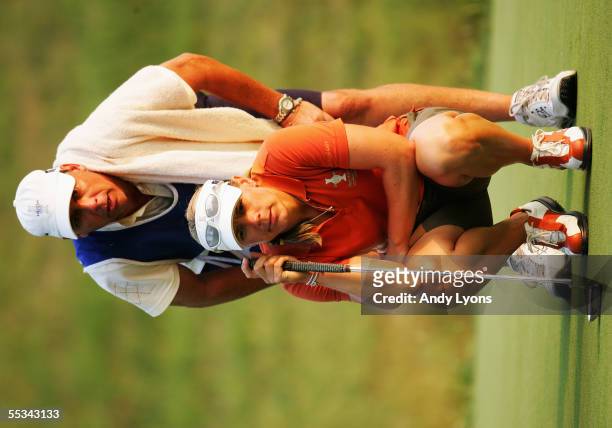 European Team member Annika Sorenstam of Sweden and her caddie Terry McNamara line up a putt on the 16th hole during her fourball match during the...