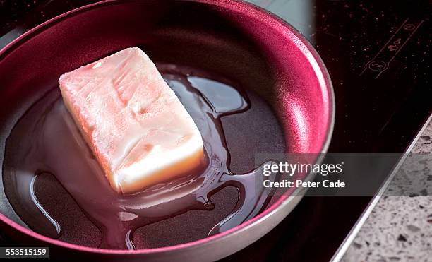 butter melting in a pan - lard stock pictures, royalty-free photos & images