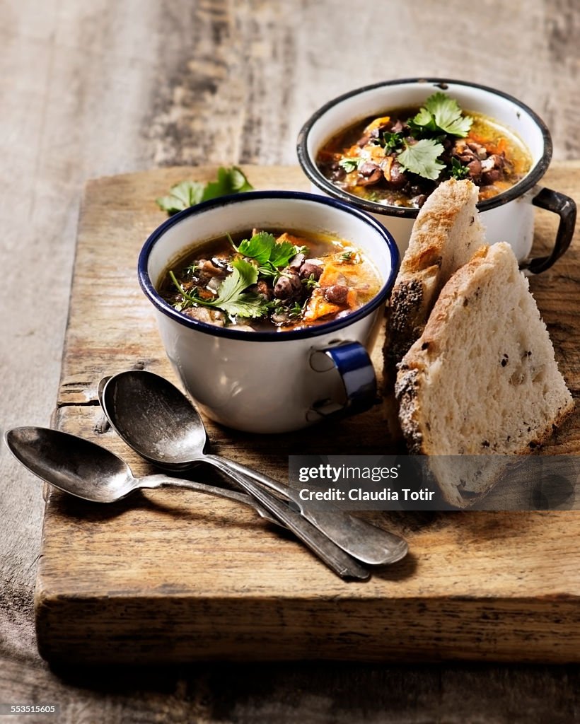 Bowls of red bean soup with vegetables