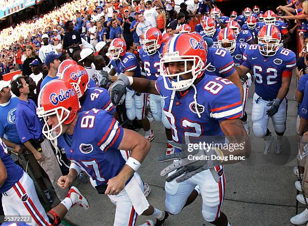 Tight end Otto Graham of the University of Florida Gators runs out with teammates to face the Louisiana Tech Bulldogs at Ben Hill Griffin Stadium on...