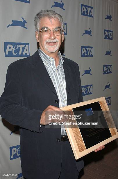 Dr. Steven Gross poses with his Matthew Eaton Activist Award backstage at PETA?s 15th Anniversary Gala and Humanitarian Awards at Paramount Studios...