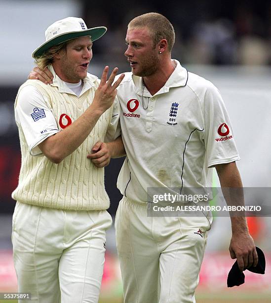 London, UNITED KINGDOM: English bowlers Matthew Hoggard and Andrew Flintoff celebrate after England dismissed Australia for a first innings total of...