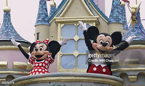 Disney characters Mickey Mouse and Minnie Mouse perform during the parade at Hong Kong Disneyland on September 11, 2005 in Hong Kong. The new theme...
