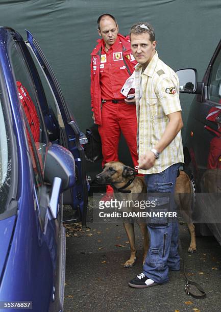 Belgium: Ferrari German driver Michael Schumacher leaves the Spa-Francorchamps racetrack after he retired from the Belgian Grand Prix, 11 September...