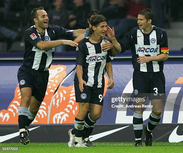 Berlin's Marko Pantelic celebrates after the second goal with Dick van Burik and Arne Friedrich during the Bundesliga match between Hertha BSC Berlin...