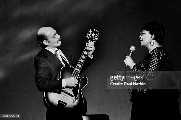 American Jazz musicians Joe Pass , on guitar, and singer Ella Fitzgerald perform during an episode of the PBS television series 'Soundstage,'...