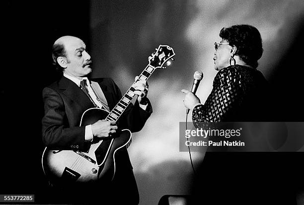 American Jazz musicians Joe Pass , on guitar, and singer Ella Fitzgerald perform during an episode of the PBS television series 'Soundstage,'...