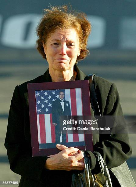 An unidentified woman holds a photograph of a relative at Ground Zero September 11, 2005 in New York City. This is the fourth anniversary of the...