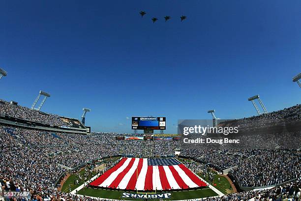 Four fighter jets flyover as a tribute to the victims of 9/11 takes place prior to the Seattle Seahawks taking on the Jacksonville Jaguars at Alltel...