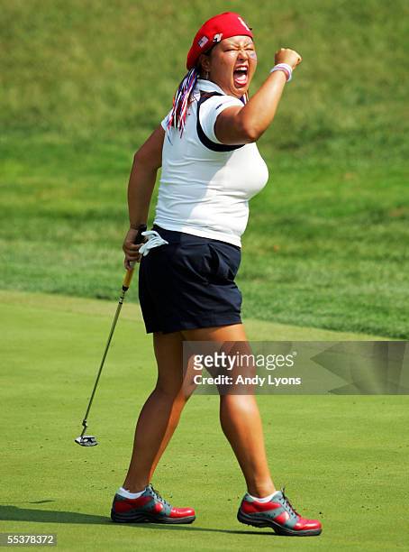 Christina Kim of the USA celebrates after making a birdie putt on the 13th green in her singles match against Ludivine Kreutz of France during final...