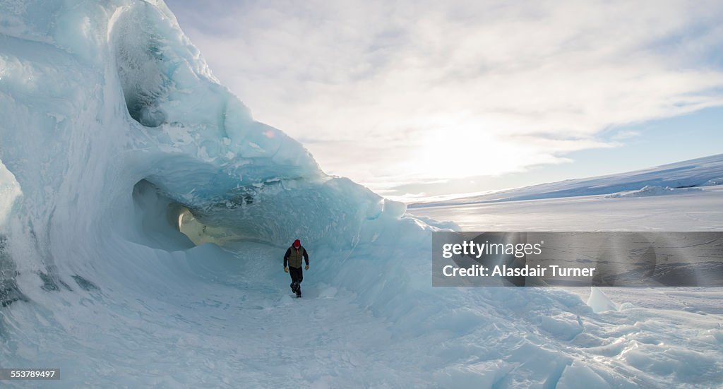 Exploring an iceberg frozen into the surface of the McMurdo Sound in the Ross Sea Region of Antarctica.