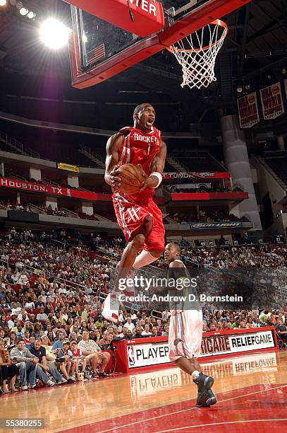 Tracy McGrady of the Houston Rockets shoots over Steve Francis of the Orlando Magic during Kenny Smith's Hurricane Katrina NBA Charity Game September...