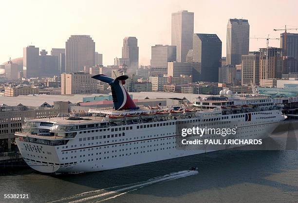 Carnival Cruise Lines' ship Ecstasy docks next to downtown New Orleans late 11 September 2005 in town with sister ship Sensation to house the...