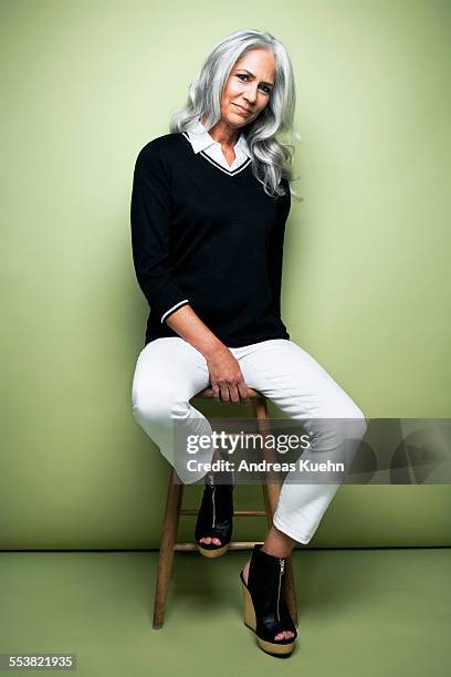 portrait of a woman with grey hair, full length. - svarta byxor bildbanksfoton och bilder