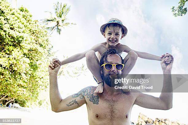 Beach Child Man Tattoo Photos And Premium High Res Pictures Getty Images beach-child-man-tattoo-photos-and-premium-high-res-pictures-getty-images