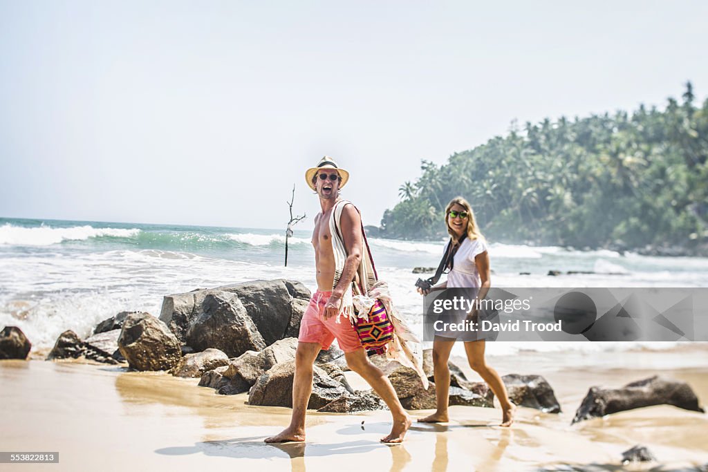 Couple walking on the beach in Sri Lanka