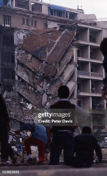 View of the collapsed facade and damage at the scene of the suicide bombing of the American Embassy, Beirut, Lebanon, April 18, 1983.