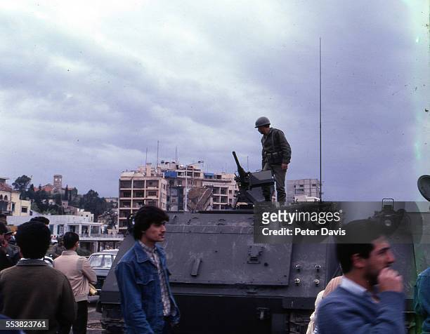Soldier on guard mans his machine gun across the street from the site of the suicide bombing of the American Embassy, Beirut, Lebanon, April 18, 1983.