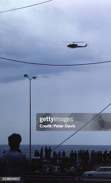 Helicopter flies near the scene of the suicide bombing of the American Embassy, Beirut, Lebanon, April 18, 1983.