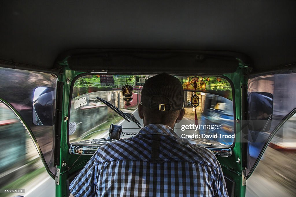 Tuk tuk driver in Sri Lanka
