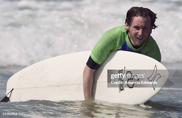 Incubus guitarist Mike Einziger participates in the Surfrider Celebrity Surf Jam at the Huntington Beach Pier on September 11, 2005 in Huntington...