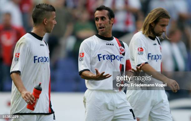 Christoph Spycher, Markus Weissenberger and Stefan Lexa of Frankfurt shows reacts during the Bundesliga match between Hanover 96 and Eintracht...