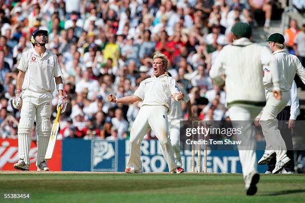 Shane Warne of Australia celebrates the wicket of Andrew Flintoff of England as Kevin Pietersen looks on during day five of the Fifth npower Ashes...