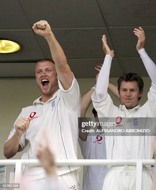 London, UNITED KINGDOM: England's Andrew Flintoff and Geraint Jones applaud after England declares and puts Australia into bat on the fifth day of...