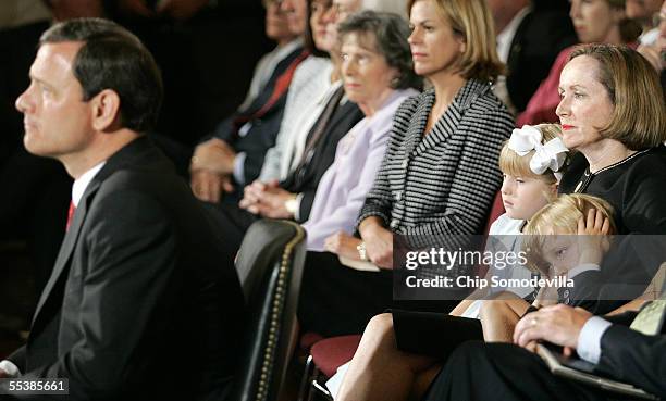 Jack Roberts , the 4-year-old son of U.S. Supreme Court Chief Justice nominee John Roberts , covers his ears while listening to opening statements by...