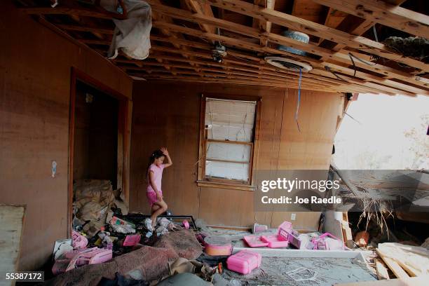 Britney Sylve walks in what used to be her bedroom looking for anything to salvage after it was destroyed by Hurricane Katrina September 12, 2005 in...