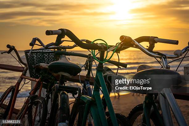 bicycles at sunset in piriapolis, maldonado - maldonado uruguay foto e immagini stock
