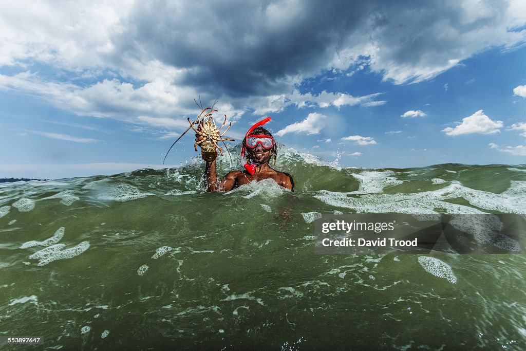 Local fisherman with live lobster