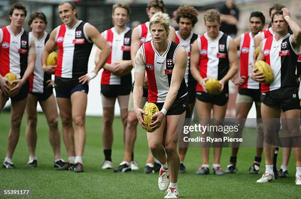 Nick Riewoldt of the Saints in action while teammates look on during the St Kilda Saints training session at the M.C.G. On September 13, 2005 in...
