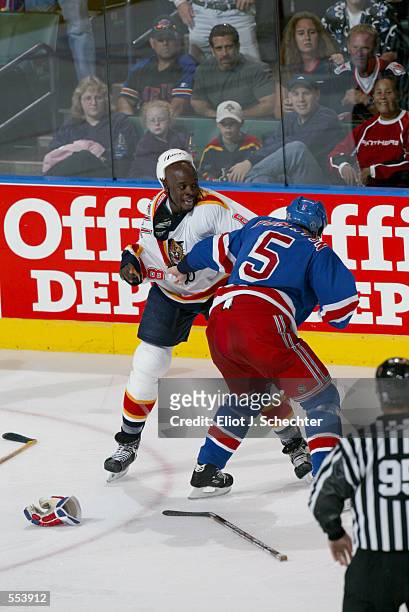 Peter Worrell of the Florida panthers fights with Dale Purinton of the New York Rangers during the game at National Car Rental Center in Sunrise,...
