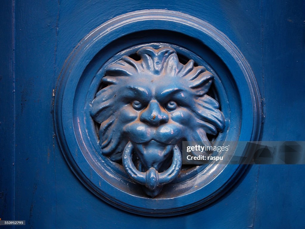 A blue lion, door knocker