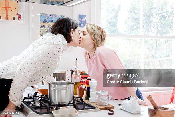 lesbian couple at home - leaninlgbt stock pictures, royalty-free photos & images