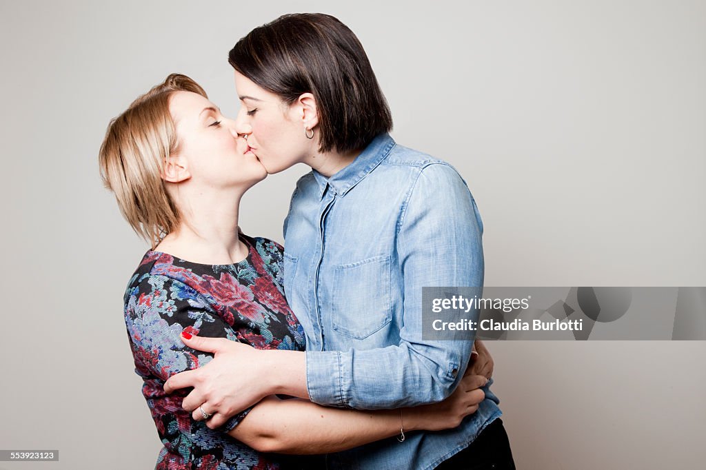 Lesbian couple kissing on the lips