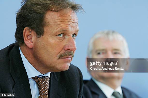 Frank Bsirske , head of the German public sector workers' union ver.di, and German Interior Minister Otto Schily attend a press conference September...