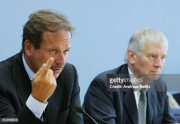 Frank Bsirske , head of the German public sector workers' union ver.di, and German Interior Minister Otto Schily attend a press conference September...