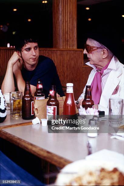 Portrait of Quentin Crisp in a New York diner with Julian Hewings of British rock band These Animal Men , United States, 1995.