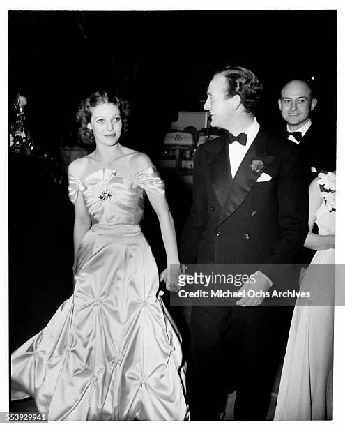 Actor David Niven and actress Loretta Young attend an event in Los Angeles, California.