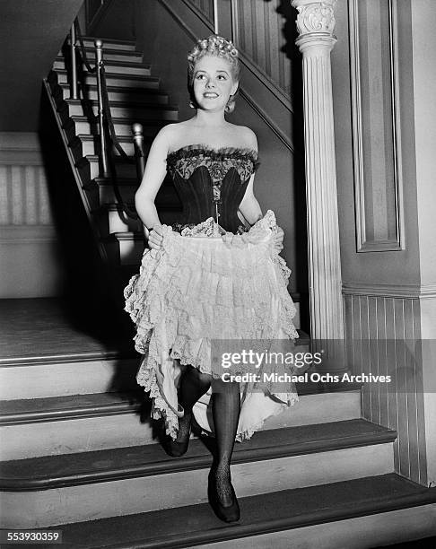 Actress Alice Faye walks down stairs as she is ready to film "Lillian Russell" in Los Angeles, California.