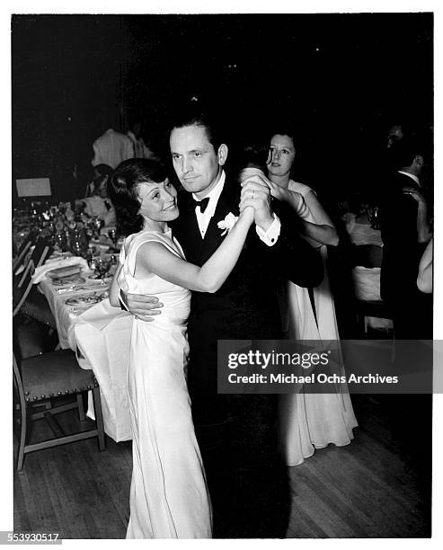 Actor Fredric March and actress Luise Rainer dance after the 10th Academy Awards in Los Angeles, California.