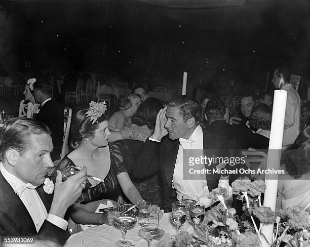 Actor Errol Flynn and wife actress Nora Eddington attend an event in Los Angeles, California.