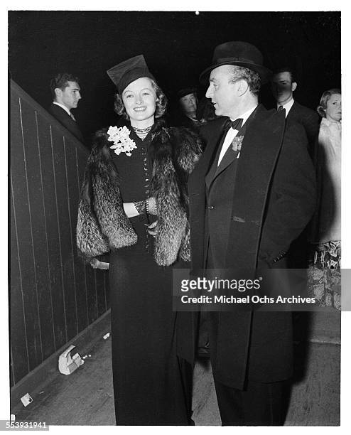 Actress Myrna Loy with husband producer Arthur Hornblow Jr. Attend an event in Los Angeles, California.