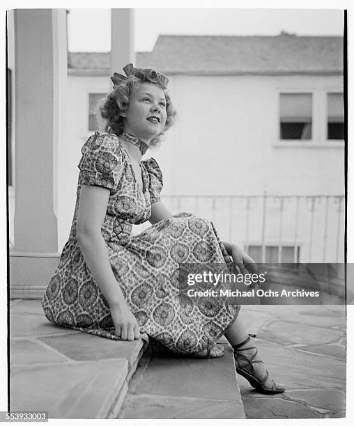 Actress Vera Ellen poses on steps in Los Angeles, California.