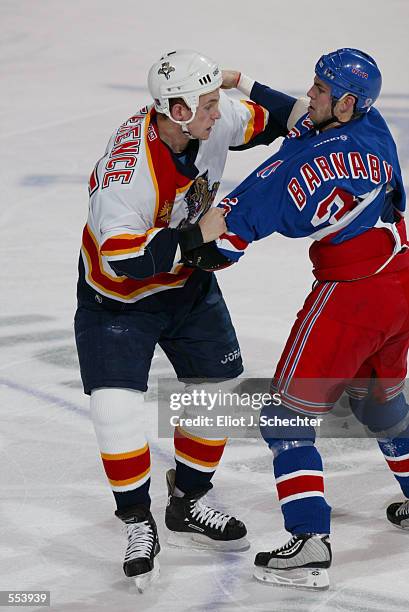 Brad Ference of the Florida Panthers and Matthew Barnaby of the New York Rangers exchange punches during the game at National Car Rental Center in...
