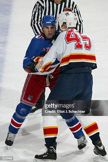 Matthew Barnaby of the New York Rangers fights with Brad Ference of the Florida Panthers during the game at National Car Rental Center in Sunrise,...